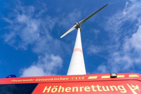 Height rescuers from the Gelsenkirchen fire brigade practise abseiling from a wind turbine from a