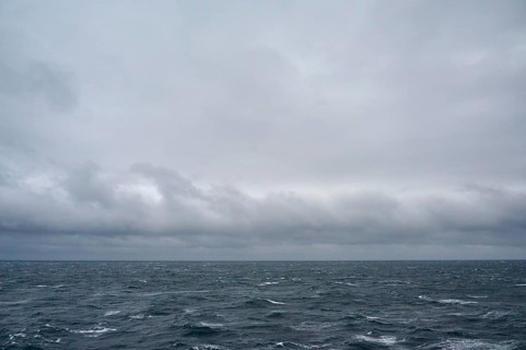 A stormy and turbulent sea under a cloudy grey sky, North Sea, Norway, Europe