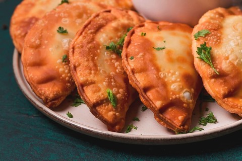 Fried mini pasties, with red sauce, top view, close-up, no people, selective focus