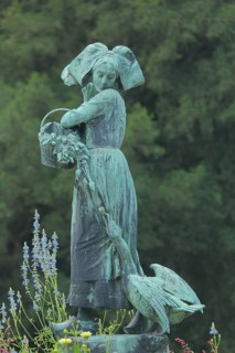 Sculpture Gänseliesel by Albert Schultz 1900, female figure with basket, goose figure and flower