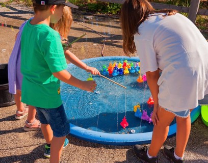 Children play fishing for animals, outdoor area SHOWPALAST MÜNCHEN, stage for shows with