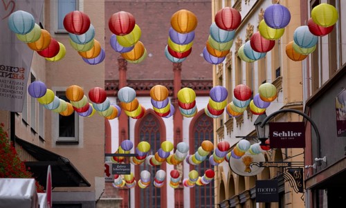 Colourful lanterns, Schustergasse, behind St. Kilian's Cathedral, historic old town, Würzburg,