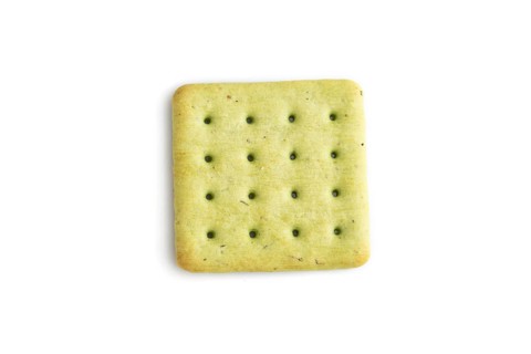 Green cracker pile isolated on white background. top view, flat lay, close up