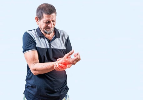 Senior man with arthritis in hands isolated. Elderly people with arthritis and hand pain