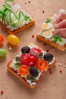 Breakfast, assortment of sandwiches, on white toast bread, top view, no people