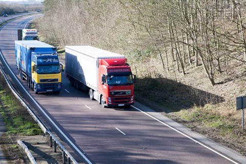 Volvo heavy goods vehicles on A12 trunk road in Suffolk, England, United Kingdom, Europe