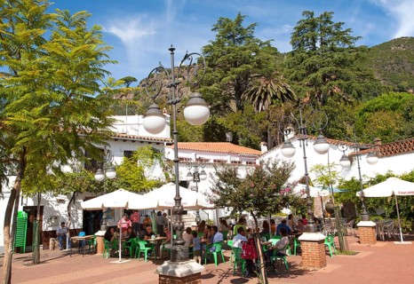 People gathered outside a cafe at Sunday lunchtime village of Alajar, Sierra de Aracena, Huelva