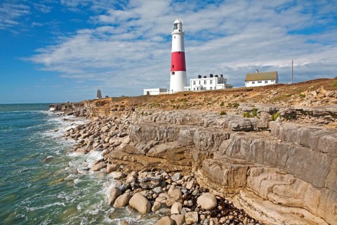 Red and white lighthouse on the coast at Portland Bill, isle of Portland, Dorset, England, United