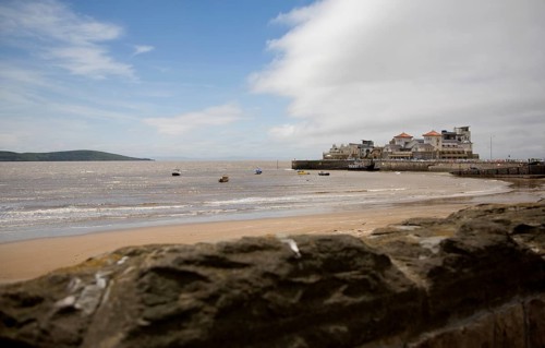 Wide sandy beach looking towards Knightstone Island, Weston super Mare Somerset, England, United