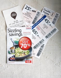 Tesco supermarket savings vouchers close up from above, UK