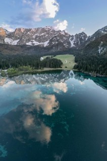 Aerial view of Lago Fusine with the Mangart massif in the background, Tarvisio, province of Udine,