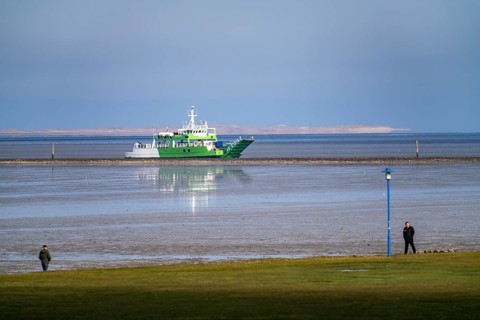 North Sea dyke, near Neuharlingersiel, ferry to the island of Spiekeroog, Lower Saxony, Germany,