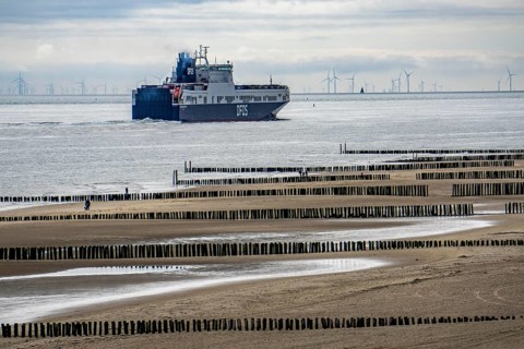 The DFDS cargo ferry Begonia Seaways, loaded with lorry trailer and new cars, leaves the