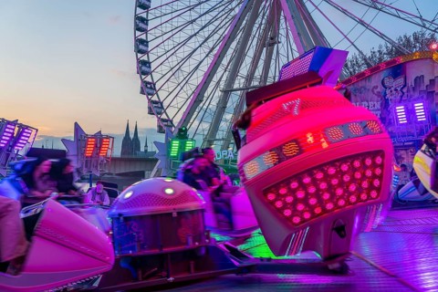 Deutz funfair on the Rhine, at Easter, funfair, break-dancer ride, Ferris wheel, Cologne Cathedral,