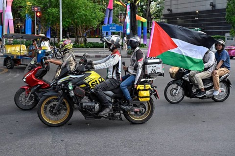 Motorcyclist with Palestine flag