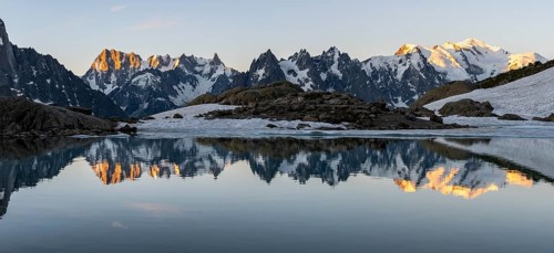 Morning atmosphere, mountain landscape at sunrise, water reflection in Lac Blanc, mountain peak,
