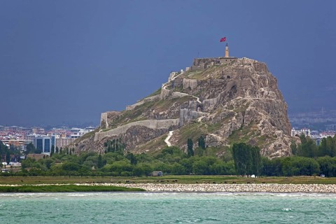 The Fortress of Van, Van Citadel, Van Kalesi on the shores of Lake Van during thunderstorm, Turkey,