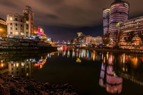 Lights reflected in the Danube Canal, on the left the Urania observatory, on the right illuminated