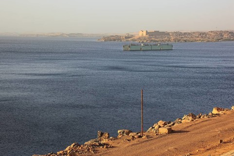 View from the dam across the Nile to the Temple of Isis at Philae on the island of Agilkia, Africa,