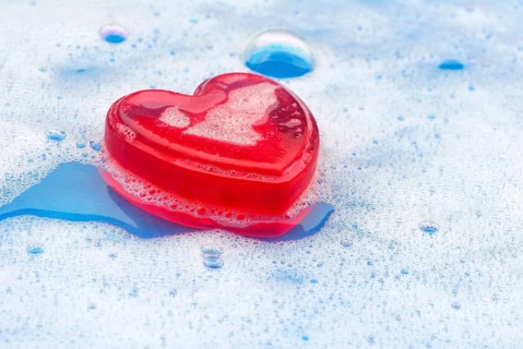 Rose soap in water with foam, Rose soap