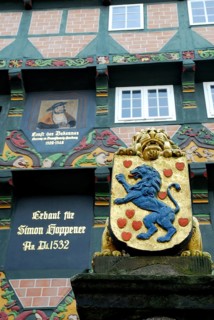 Fountain column with lion, coat of arms and half-timbered house, Hoppener Haus, Celle, Lower