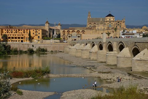 Roman bridge, Puente Viejo, over the Guadalquivir river, Mosque–Cathedral of Córdoba or Mezquita at