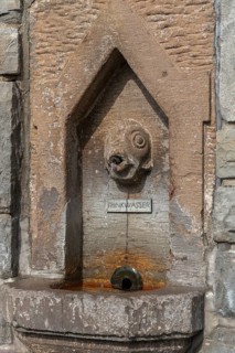 Meersburg on Lake Constance, fish spits water jet, inscription drinking water, fountain, close-up,