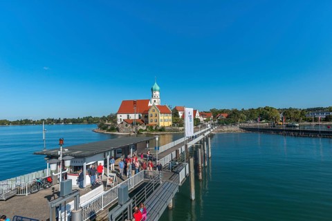 Moated castle, Lake Constance, kiosk, jetty, tourists, parish church of St George, onion dome,