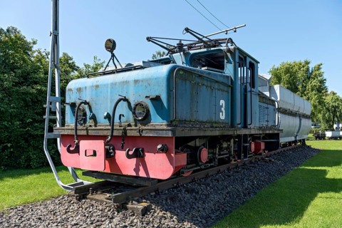 Vintage electric locomotive no. 3 from Krupp AEG with coal wagon for transporting lignite in