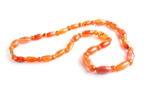 Colored onyx beads isolated on white background. top view, close up