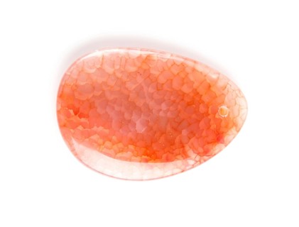 Colored onyx pendant isolated on white background, close up