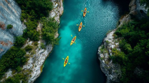 Aerial view of kayakers paddling along a beautiful mountain river. generative AI, AI generated