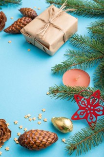 Christmas or New Year composition. Decorations, box, cinnamon, cones, fir and spruce branches, cup