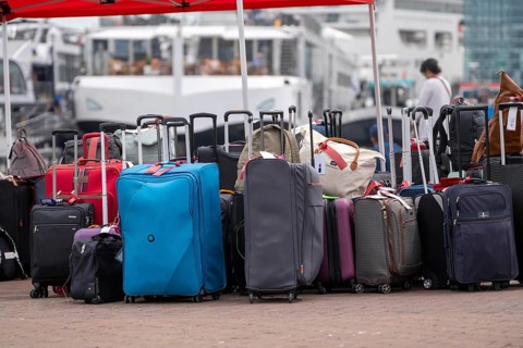 Luggage waiting to be loaded onto river cruise ships at Viking Cruise Port Amsterdam, Netherlands