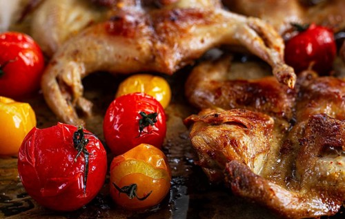 Grilled quail meat, on a platter, tobacco, in the oven, with spices, homemade, without people