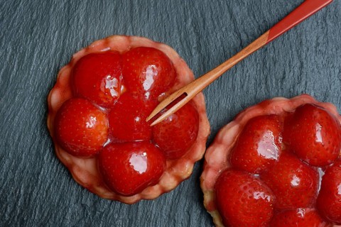 Topped strawberry tarts with a fork