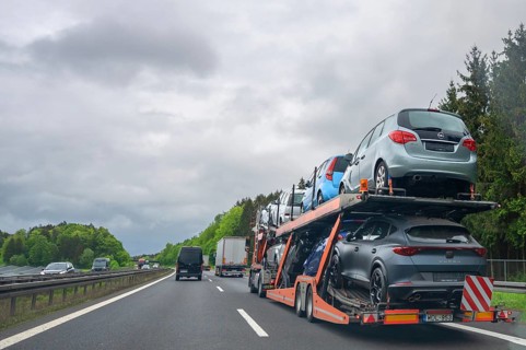 Truck transporter loaded with new cars on the A6 motorway, Bavaria, Germany, Europe