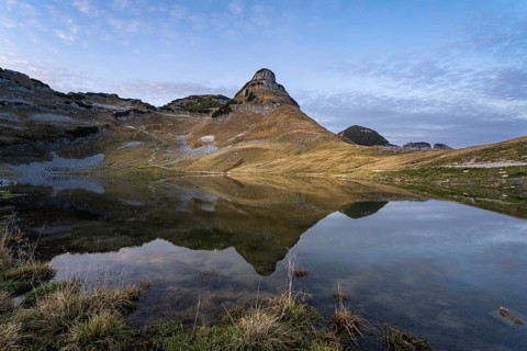 Lake Augstsee and the Atterkogel mountain on the Loser. Autumn, good weather, blue sky. In the