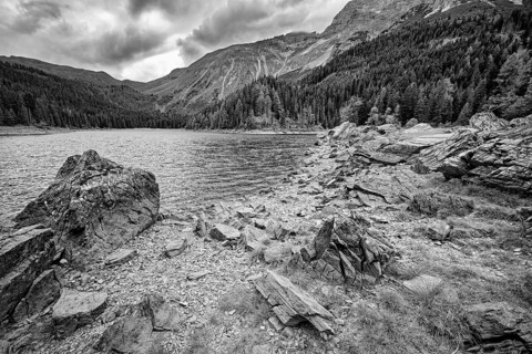 Obernberger See, mountain lake, landscape of the Stubai Alps, weather mood, cloud mood, black and