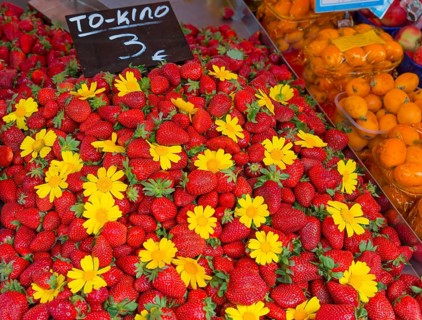 Market stall with fresh strawberries and yellow flowers, price tag available, market, Nafplio,