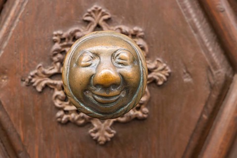 Stahlesches Schwesternhaus in the street Eisgrube in Bamberg. Doorknob with a cheerful face, known