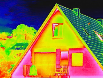Apartment block, facade of a residential building with windows. Thermal image or thermography,