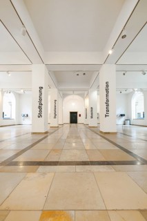 Bright exhibition hall with white walls and themed texts, University of Stuttgart, Germany, Europe