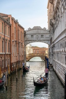 Venetian gondolas on the Rio di Palazzo canal with Bridge of Sighs, Venice, Veneto, Italy, Europe