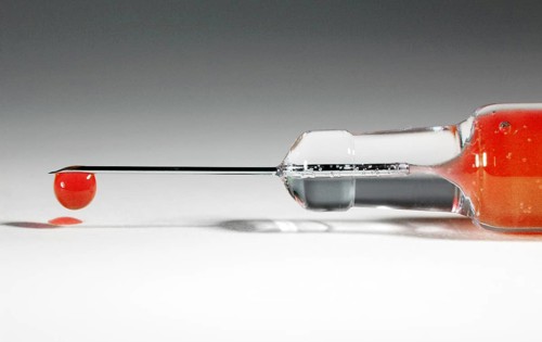A syringe with donated blood, blood drop, Vienna, Austria, Europe