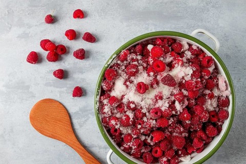 Fresh raspberry berry, covered with granulated sugar, jam preparation, top view, no people