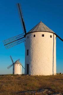 Large windmill in the sunlight with another one in the background, Campo de Criptana, Ciudad Real