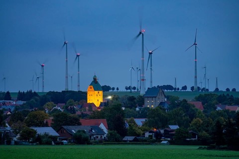 Wind farm above the village of Lichtenau, self-proclaimed energy town, houses with photovoltaic