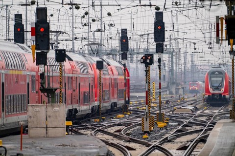 Railway tracks with regional trains, after freezing rain, in front of Frankfurt main station,