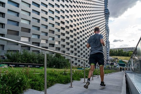CopenHill, waste incineration plant and artificial ski slope, athletes use the stairs and paths for